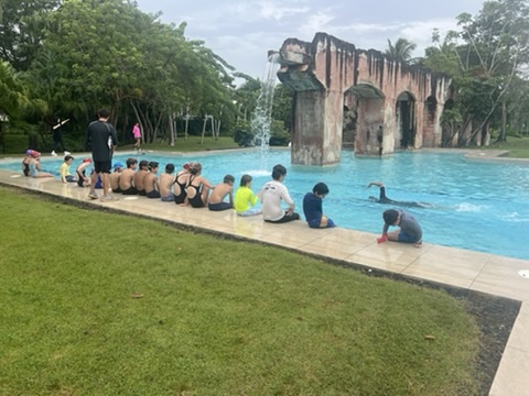 Leading a group swim lesson at Isla Swim Academy